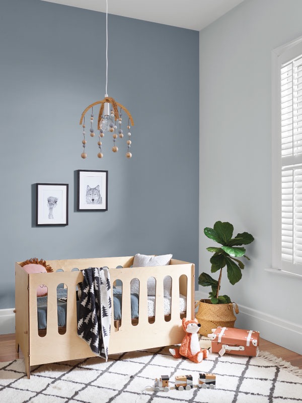 Picture of wooden cot in baby's room