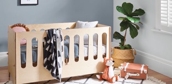 Picture of wooden cot in baby's room